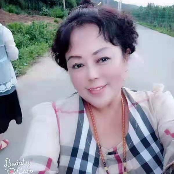 妩媚拿大雁的照片