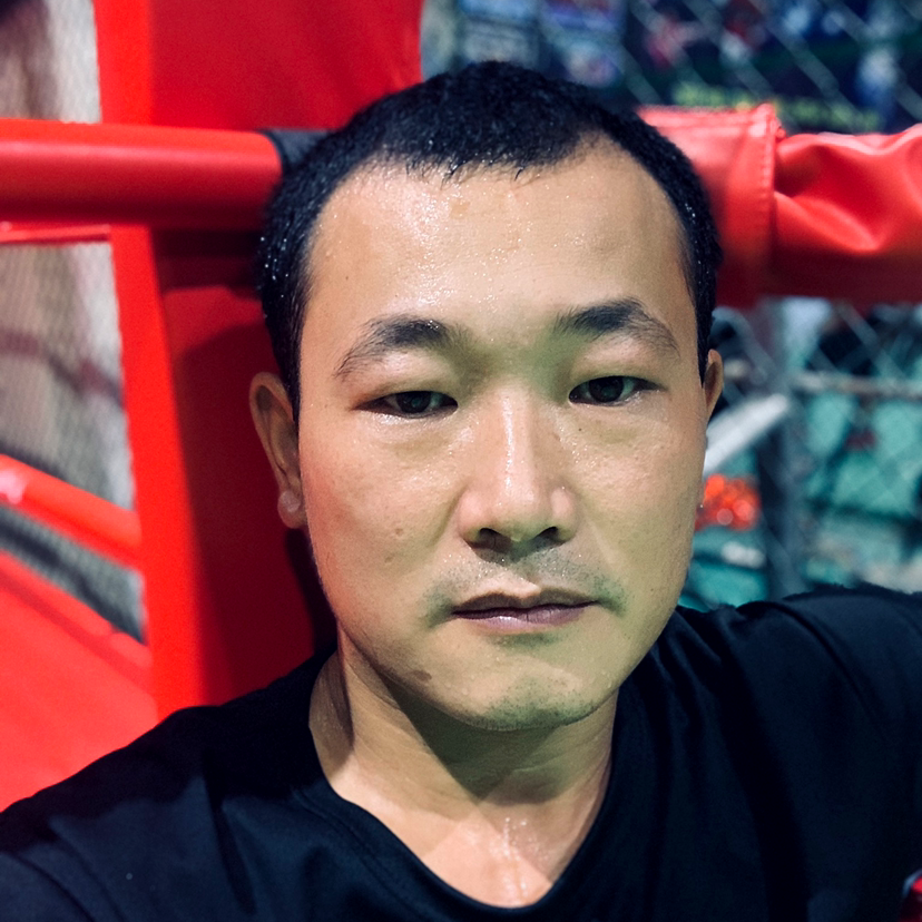 种田的搏击教练的照片
